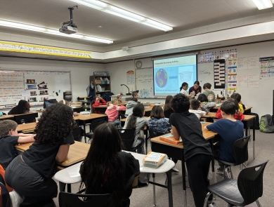 A photo of Bear River Migratory Bird Refuge intern Gabrielle Johnson leading an In-School Junior Duck Stamp Education Program.