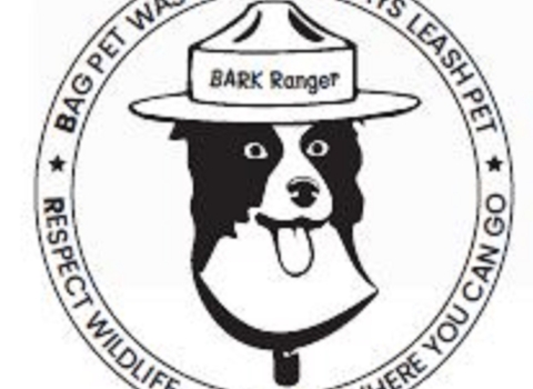 Cartoon dog with hat that says "BARK Ranger" and the words "Bag pet waste. Always leash pet. Respect wildlife. Know where you can go." 