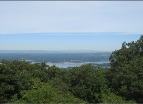 Photograph from a wooded hilltop of the Hudson River 