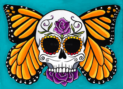 a decorative skull with orange and black monarch wings and purple flowers 