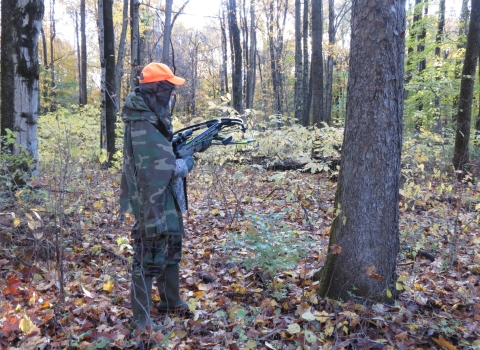 Image of bow hunter in woods
