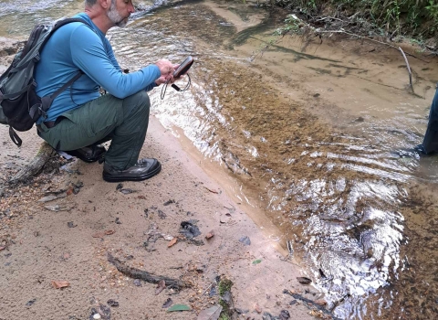 US Forest Service staff marks waypoint for future a mussel bed location
