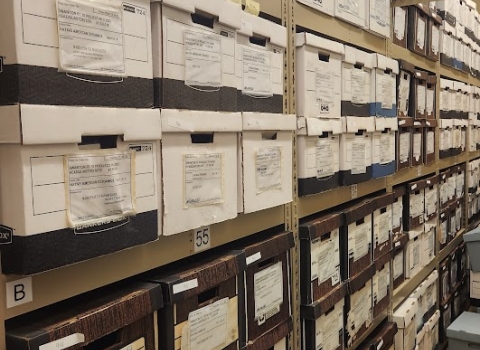 Many rows of corrugated evidence boxes stacked on shelves