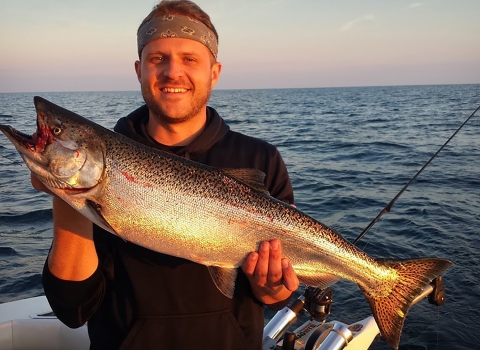 A man holding a large fish