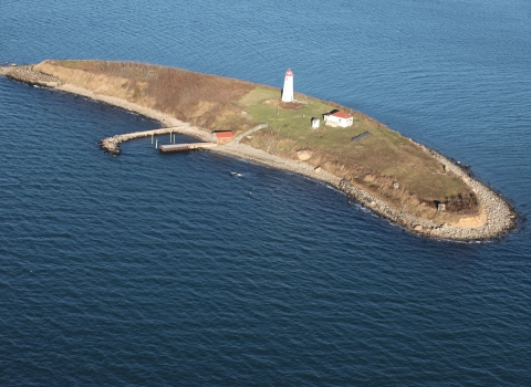 An aerial view of Falkner Island, lighthouse, and building, in CT