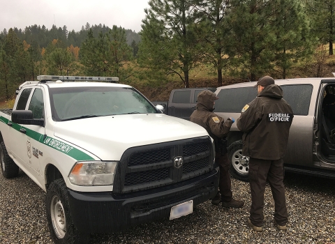 FWS Patrol Captain Kelly Knutson, a Federal Wildlife Officer, and a U.S. Forest Service agent worked together on the firewood case. 