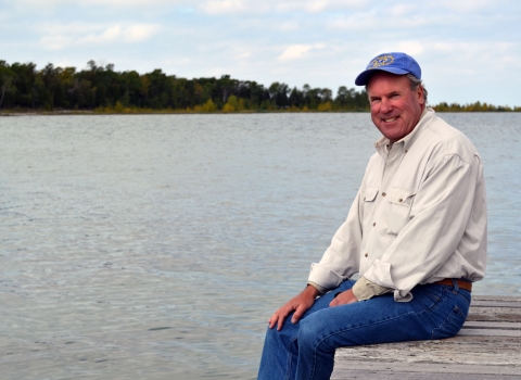 Regional Director Charlie Wooley on a dock at Green Bay National Wildlife Refuge