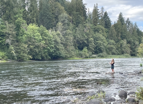 A Rosemary Anderson High School Student fishes on Oregon's Clackamas River. 