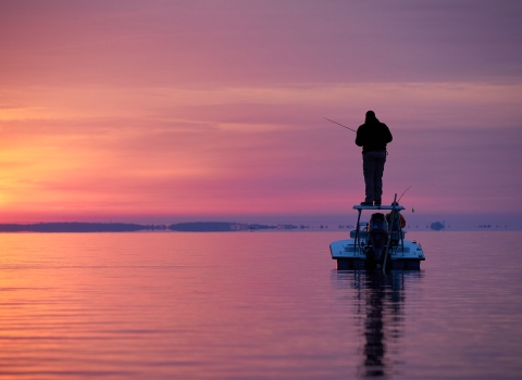 Sunset fishing on a boat