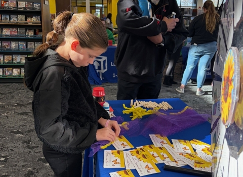 child making a butterfly craft